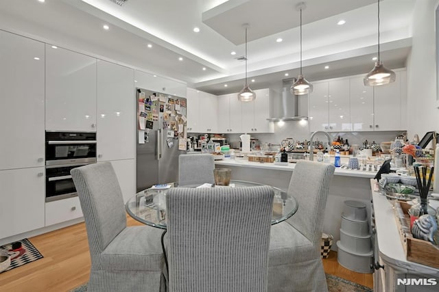 712 Undercliff Ave, Edgewater, NJ 07020 - dining area featuring light wood-style flooring and recessed lighting