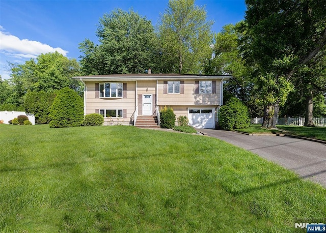 30 Fox Hill Rd, Fairfield, NJ 07004 - split foyer home featuring driveway, a garage, and a front yard