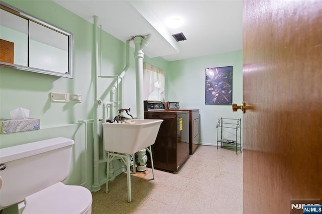 30 Fox Hill Rd, Fairfield, NJ 07004 - bathroom featuring tile patterned floors, washing machine and dryer, and toilet