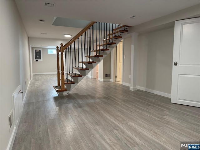 41 Woods Ave, Bergenfield, NJ 07621 - stairway featuring wood finished floors and baseboards