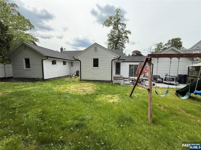41 Woods Ave, Bergenfield, NJ 07621 - back of property featuring a patio