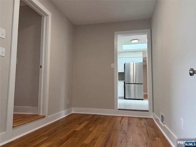 41 Woods Ave, Bergenfield, NJ 07621 - unfurnished room with dark wood-style floors and baseboards