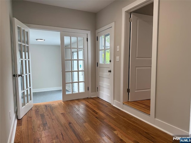 41 Woods Ave, Bergenfield, NJ 07621 - doorway to outside featuring dark wood-style floors, baseboards, and french doors