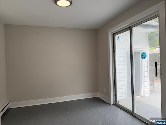 41 Woods Ave, Bergenfield, NJ 07621 - empty room featuring a baseboard radiator and baseboards