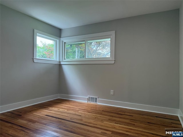 41 Woods Ave, Bergenfield, NJ 07621 - empty room featuring baseboards and wood finished floors