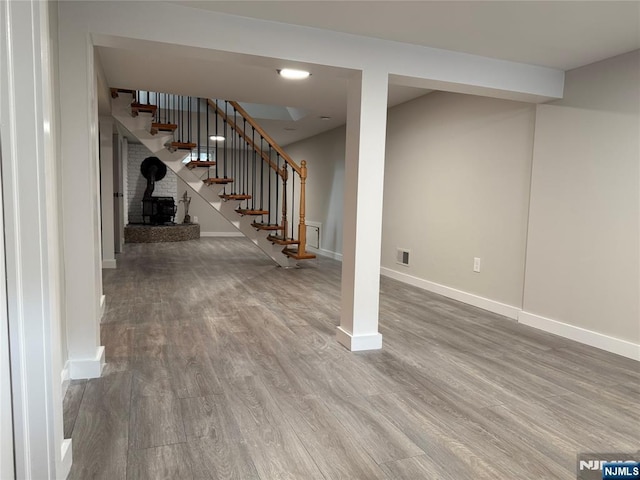 41 Woods Ave, Bergenfield, NJ 07621 - basement with wood finished floors, stairs, and baseboards