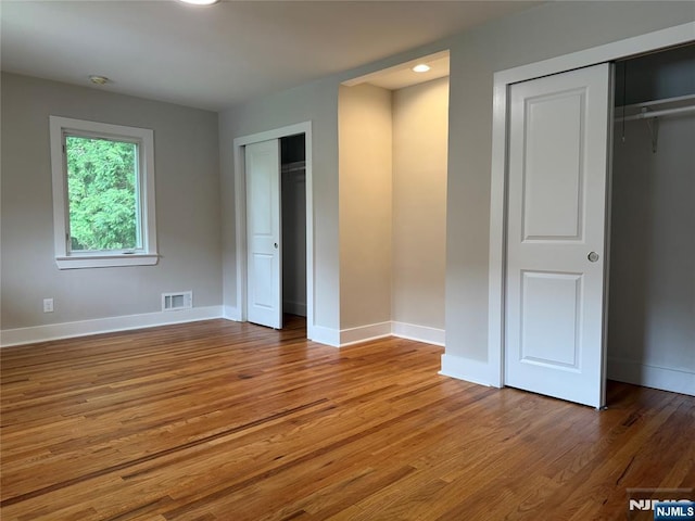 41 Woods Ave, Bergenfield, NJ 07621 - unfurnished bedroom featuring wood finished floors and baseboards