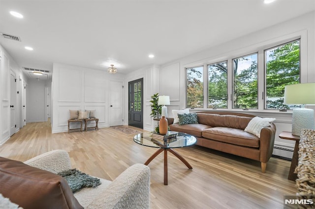 104 Myrtle Ave, Ramsey, NJ 07446 - living area featuring a decorative wall, light wood finished floors, a baseboard radiator, and recessed lighting