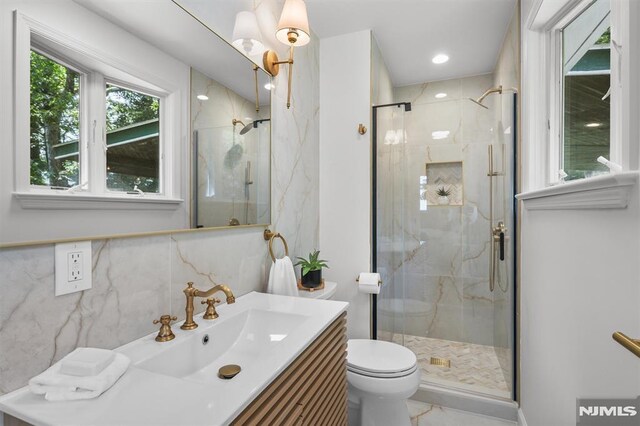 104 Myrtle Ave, Ramsey, NJ 07446 - bathroom featuring vanity, a marble finish shower, marble finish flooring, and tile walls