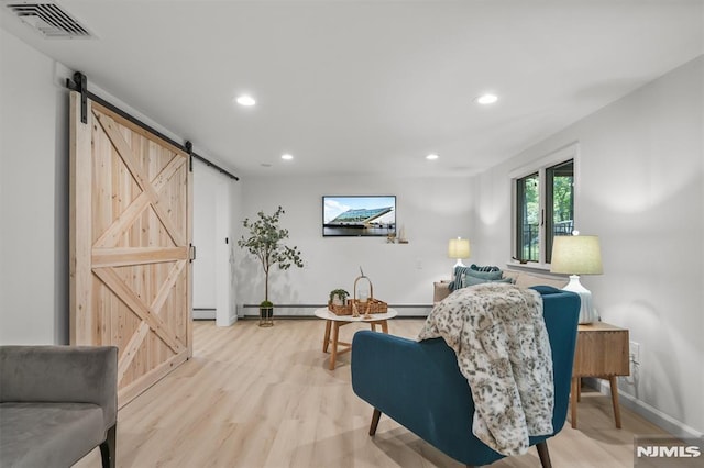 104 Myrtle Ave, Ramsey, NJ 07446 - living room featuring a barn door, recessed lighting, light wood-type flooring, and a baseboard heating unit