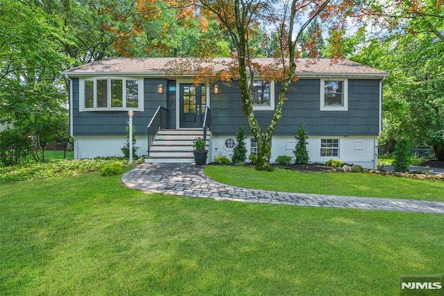 104 Myrtle Ave, Ramsey, NJ 07446 - view of front of house featuring a front lawn, french doors, and roof with shingles