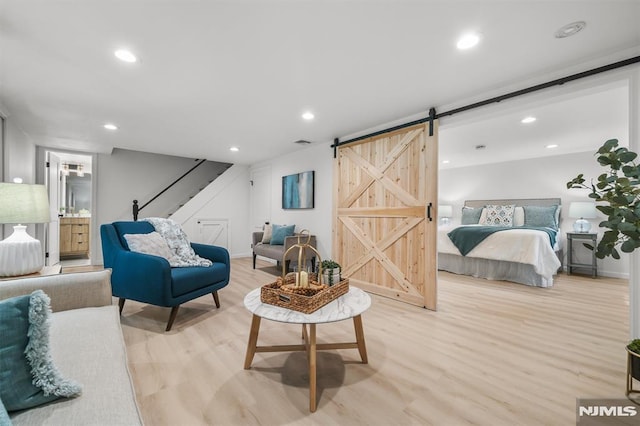 104 Myrtle Ave, Ramsey, NJ 07446 - living area featuring light wood-style floors, a barn door, stairs, and recessed lighting