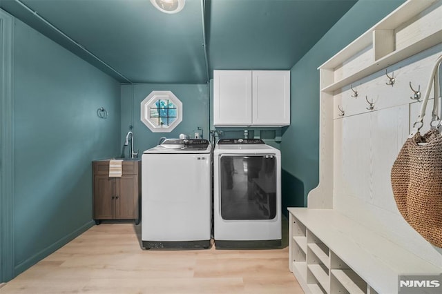 104 Myrtle Ave, Ramsey, NJ 07446 - laundry room with cabinet space, washer and clothes dryer, and light wood-style floors