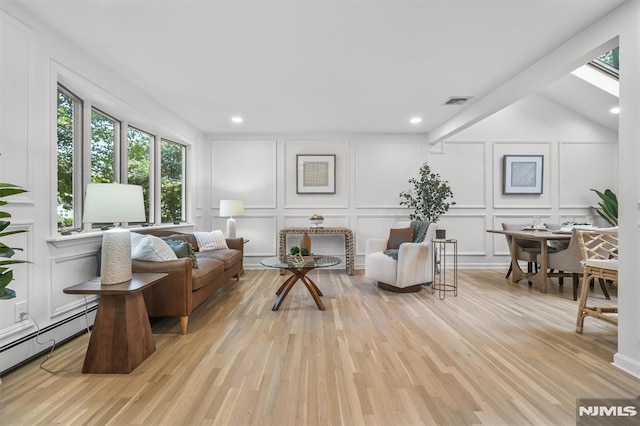 104 Myrtle Ave, Ramsey, NJ 07446 - living area featuring a decorative wall, healthy amount of natural light, light wood finished floors, a baseboard radiator, and recessed lighting