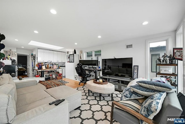 716 Undercliff Ave, Edgewater, NJ 07020 - living area featuring a skylight, recessed lighting, and light wood finished floors