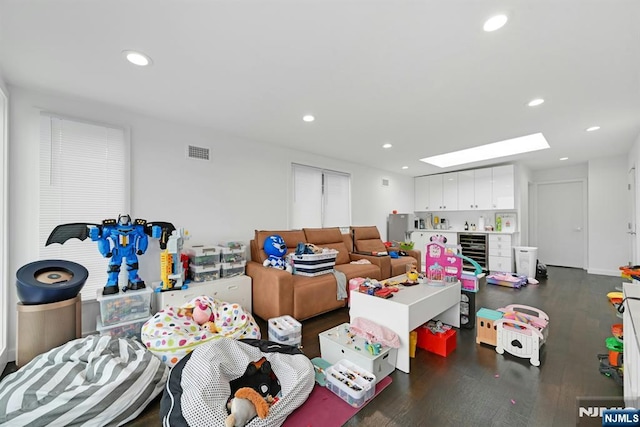 716 Undercliff Ave, Edgewater, NJ 07020 - game room with wine cooler, wood finished floors, a skylight, and recessed lighting
