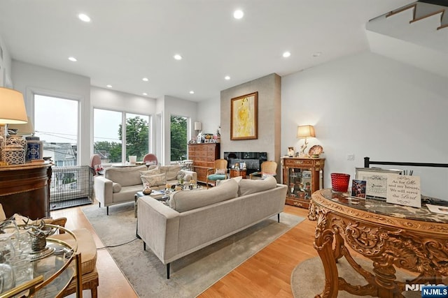 716 Undercliff Ave, Edgewater, NJ 07020 - living area with a multi sided fireplace, light wood-type flooring, and recessed lighting