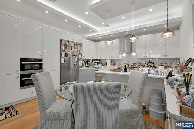 716 Undercliff Ave, Edgewater, NJ 07020 - dining room with light wood-type flooring and recessed lighting