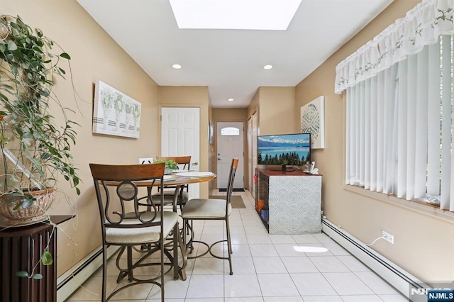 300 Wilson Ave, Lyndhurst, NJ 07071 - dining room with a baseboard heating unit, baseboards, light tile patterned floors, a skylight, and recessed lighting