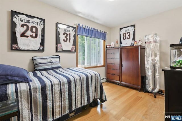 300 Wilson Ave, Lyndhurst, NJ 07071 - bedroom with wood finished floors and baseboard heating