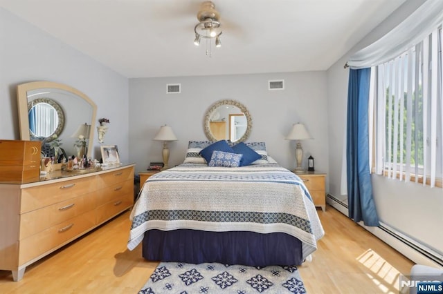 300 Wilson Ave, Lyndhurst, NJ 07071 - bedroom featuring light wood finished floors and baseboard heating