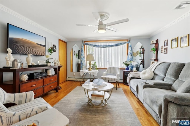 300 Wilson Ave, Lyndhurst, NJ 07071 - living room featuring a ceiling fan, crown molding, light wood finished floors, baseboard heating, and a baseboard heating unit