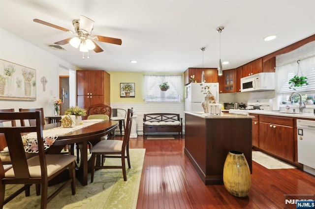 300 Wilson Ave, Lyndhurst, NJ 07071 - kitchen with white appliances, a sink, healthy amount of natural light, a kitchen island, and recessed lighting