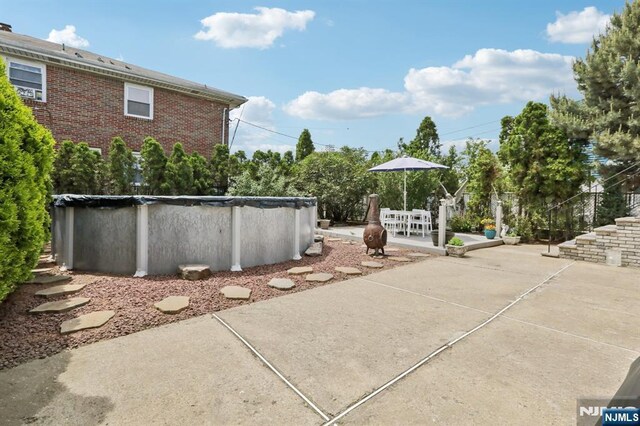 300 Wilson Ave, Lyndhurst, NJ 07071 - view of patio with a covered pool