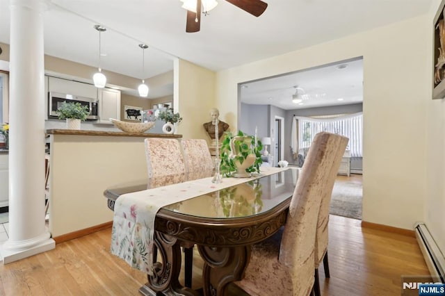 300 Wilson Ave, Lyndhurst, NJ 07071 - dining space with decorative columns, a baseboard radiator, light wood-style floors, a ceiling fan, and baseboards