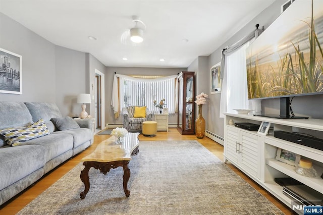300 Wilson Ave, Lyndhurst, NJ 07071 - living area featuring a baseboard radiator, wood finished floors, and baseboard heating