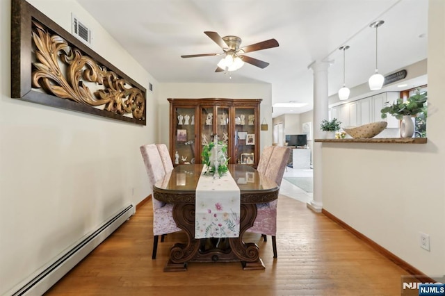 300 Wilson Ave, Lyndhurst, NJ 07071 - dining space featuring baseboard heating, ceiling fan, wood finished floors, and baseboards