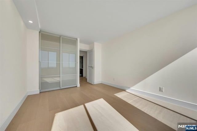 200 Winston Unit 2912, Cliffside Park, NJ 07010 - empty room with wood finished floors, baseboards, and recessed lighting