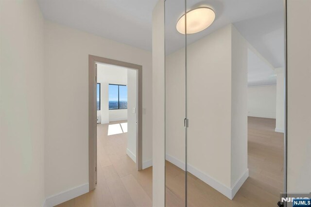 200 Winston Unit 2912, Cliffside Park, NJ 07010 - hallway featuring light wood-style floors and baseboards