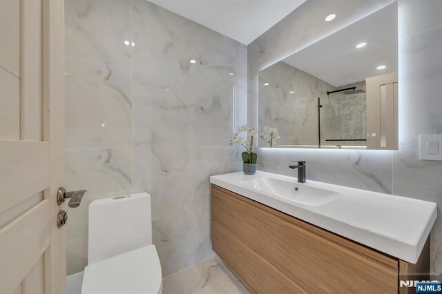 200 Winston Unit 2912, Cliffside Park, NJ 07010 - full bathroom with tile walls, vanity, a shower, and toilet