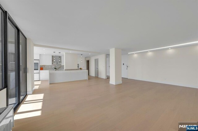 200 Winston Unit 2912, Cliffside Park, NJ 07010 - unfurnished living room featuring light wood finished floors