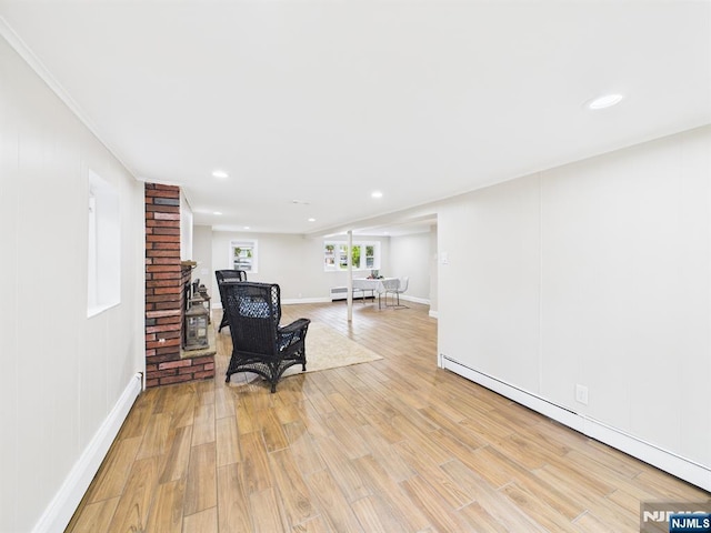 440 Albin Ct, Ridgewood, NJ 07450 - living area with a baseboard radiator, light wood finished floors, recessed lighting, baseboards, and a fireplace
