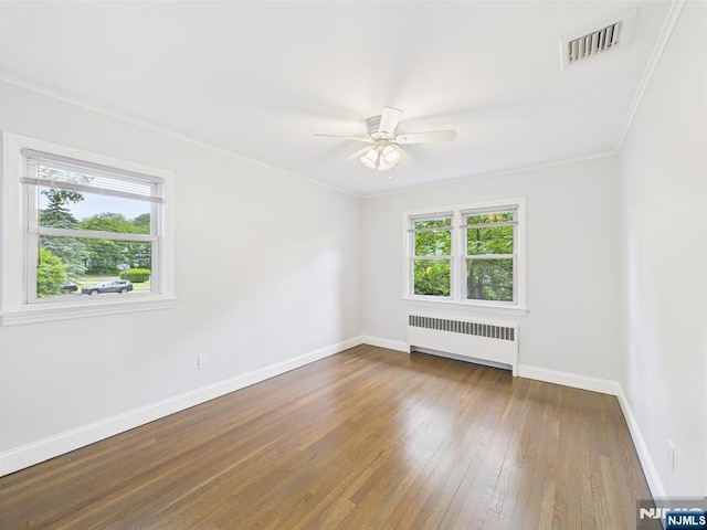 440 Albin Ct, Ridgewood, NJ 07450 - unfurnished room featuring radiator, healthy amount of natural light, hardwood / wood-style floors, baseboards, and crown molding