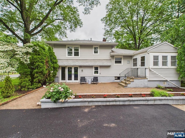 440 Albin Ct, Ridgewood, NJ 07450 - back of house featuring a chimney and a patio area