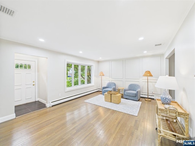 440 Albin Ct, Ridgewood, NJ 07450 - sitting room featuring baseboard heating, hardwood / wood-style floors, a decorative wall, and recessed lighting