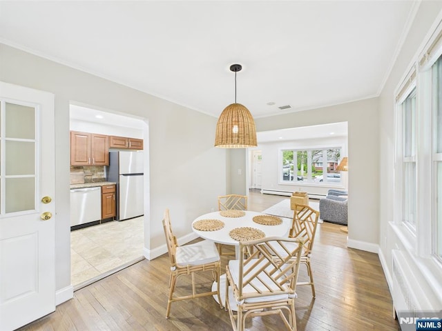 440 Albin Ct, Ridgewood, NJ 07450 - dining area featuring light wood finished floors, ornamental molding, a baseboard heating unit, and baseboards