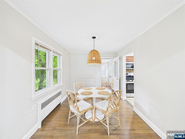 440 Albin Ct, Ridgewood, NJ 07450 - dining area featuring radiator, crown molding, wood finished floors, and baseboards