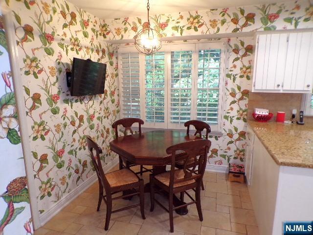 20 Carriage Ln, Ridgewood, NJ 07450 - dining area with wallpapered walls and baseboards
