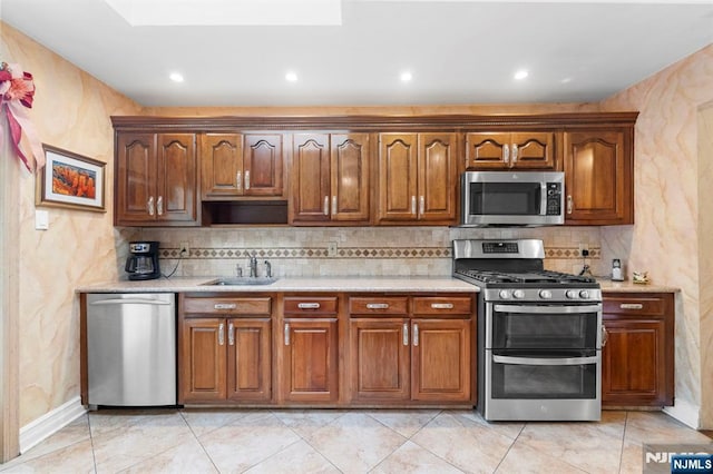 9 E Brook Dr, Paramus, NJ 07652 - kitchen featuring stainless steel appliances, a sink, tasteful backsplash, recessed lighting, and brown cabinets