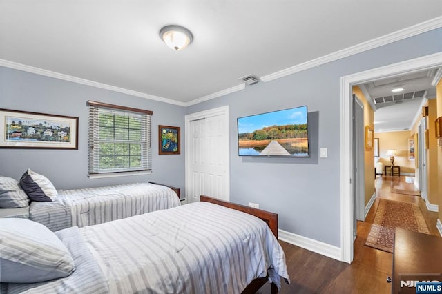 9 E Brook Dr, Paramus, NJ 07652 - bedroom with wood finished floors, crown molding, a closet, baseboards, and attic access