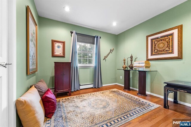 9 E Brook Dr, Paramus, NJ 07652 - living area featuring a baseboard radiator, wood finished floors, baseboards, and recessed lighting