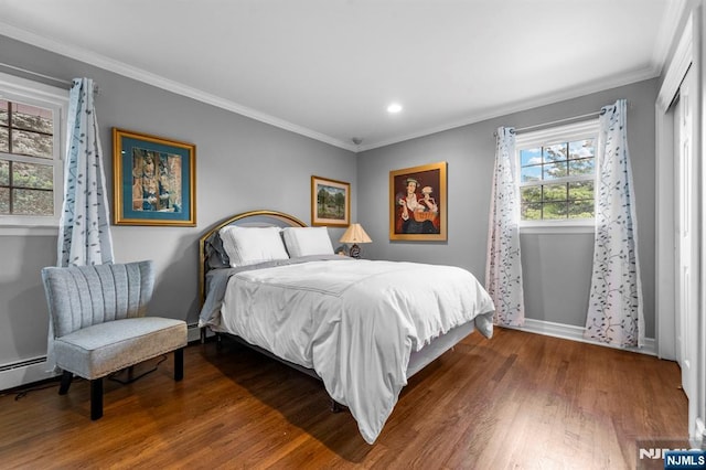 9 E Brook Dr, Paramus, NJ 07652 - bedroom featuring wood finished floors, ornamental molding, recessed lighting, baseboards, and baseboard heating