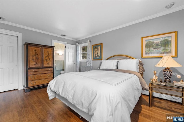 9 E Brook Dr, Paramus, NJ 07652 - bedroom featuring crown molding, dark wood-style flooring, and connected bathroom