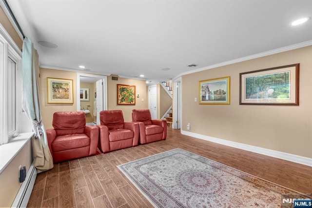 9 E Brook Dr, Paramus, NJ 07652 - living room with baseboard heating, wood finished floors, crown molding, stairs, and baseboards