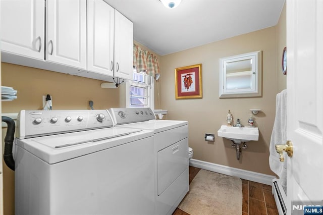 9 E Brook Dr, Paramus, NJ 07652 - washroom with washer and dryer, a baseboard radiator, baseboards, and cabinet space