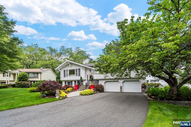 9 E Brook Dr, Paramus, NJ 07652 - raised ranch featuring driveway and a front yard